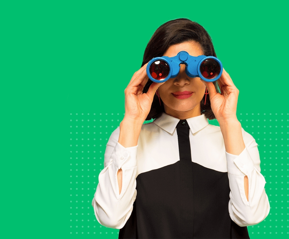 Woman gazing at the viewer through blue binoculars